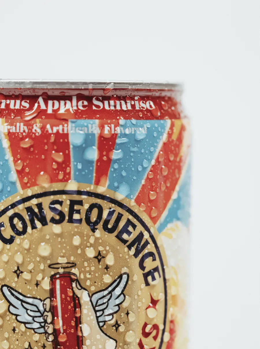 Close-up of a chilled Citrus Apple Sunrise can with condensation