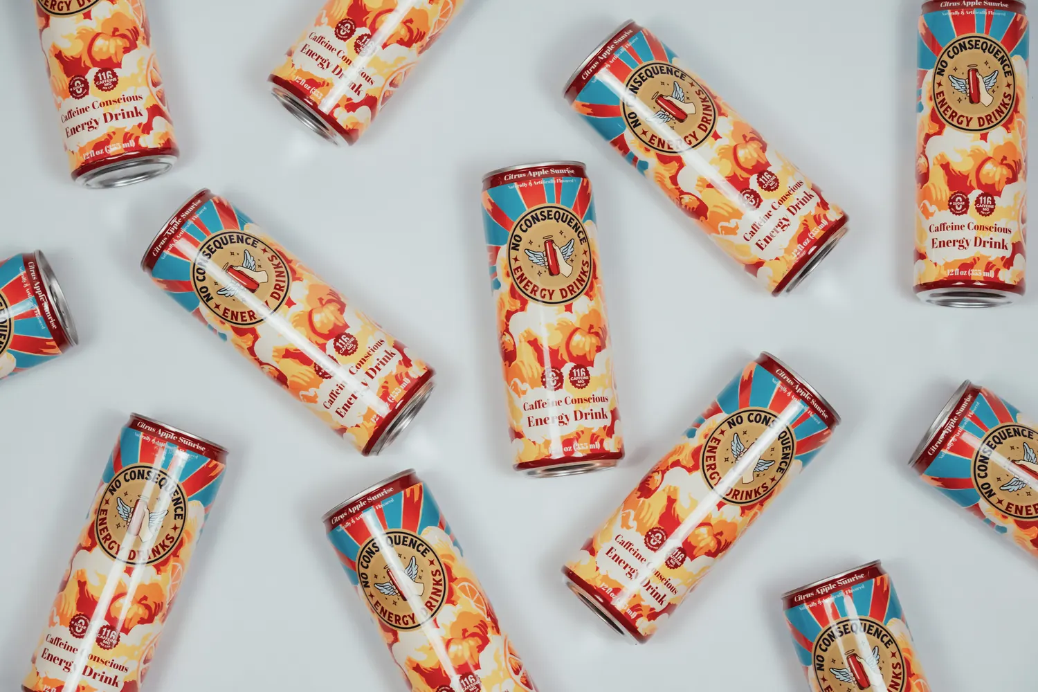 Citrus Apple Sunrise cans scattered across a white surface